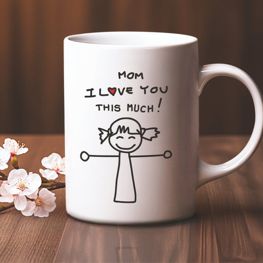 white coffee mug says Mom I LoveYou This Much, with a little girl holding her arms open wide